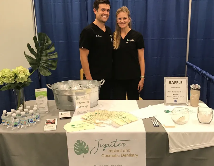 Dr. Shane and Dr. Amiee Vaughn at the practice's stand at a local Jupiter event.