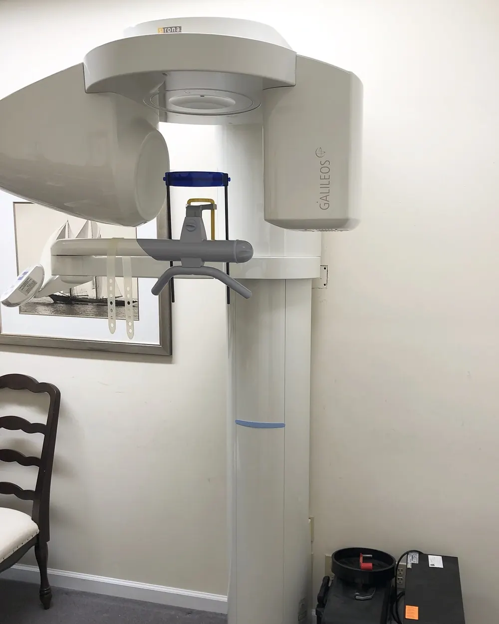 The 3-D cone beam CT scanner in the office, used to plan every implant.